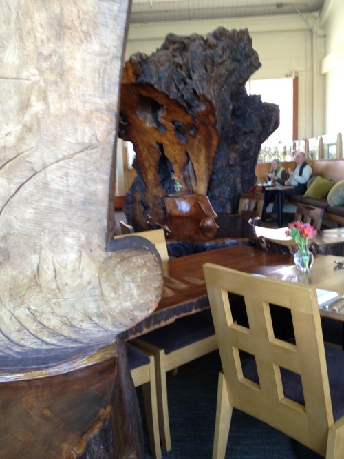 Greens Restaurant dining room with the massive tree trunk