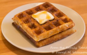 Roasted corn and bacon waffles with butter and maple syrup